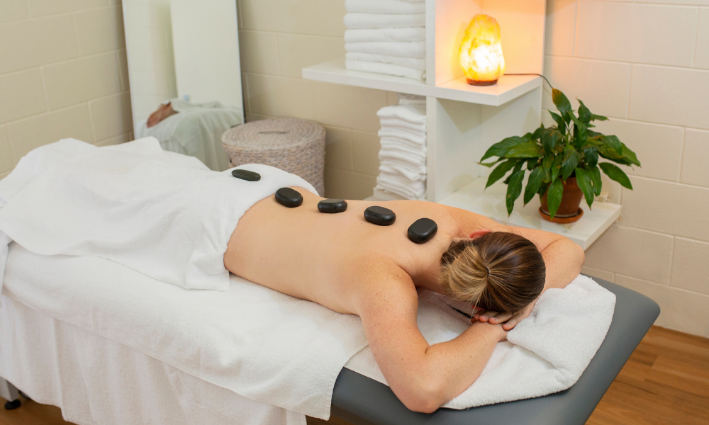 Women getting hot stone massage